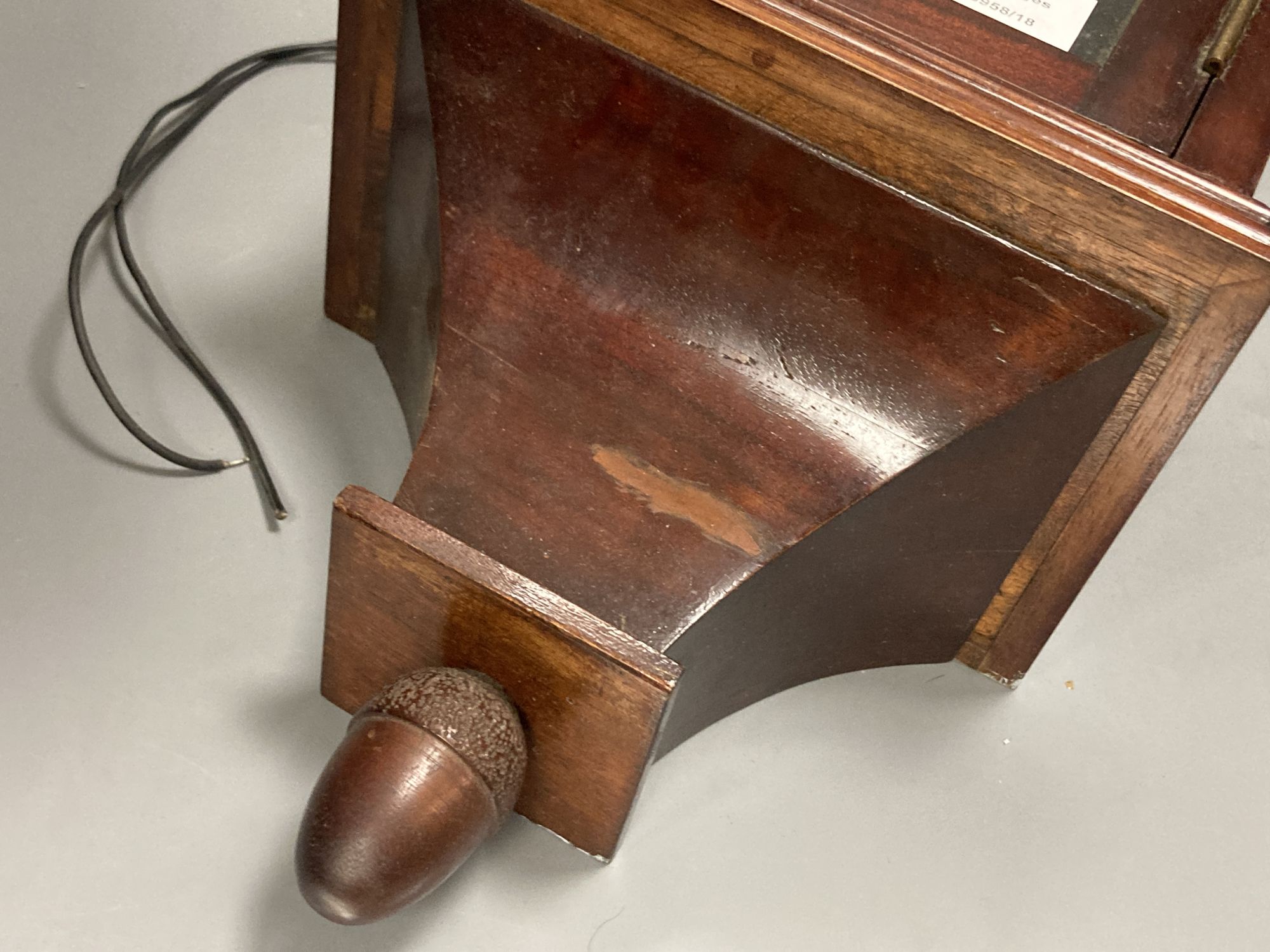 An early 20th century mahogany cased electric wall clock, with acorn pendant, height 66cm